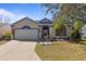 Charming home featuring a well-manicured lawn, two car garage and a decorative color scheme at 4630 56Th E Dr, Bradenton, FL 34203
