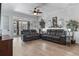 Comfortable living room with modern ceiling fan, neutral colors and vinyl floors at 4630 56Th E Dr, Bradenton, FL 34203