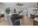 Spacious living room featuring modern decor, wood floors and a large table at 4630 56Th E Dr, Bradenton, FL 34203