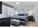 Spacious main bedroom with accent wall and large comfortable king bed at 4630 56Th E Dr, Bradenton, FL 34203