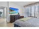 Spacious main bedroom with tv and window for natural light at 4630 56Th E Dr, Bradenton, FL 34203