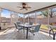 Relaxing screened patio with tiled floors, a ceiling fan, and ample space for outdoor dining at 4630 56Th E Dr, Bradenton, FL 34203
