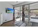 Bright sunroom with sliding glass doors and backyard views at 4630 56Th E Dr, Bradenton, FL 34203