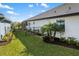 Private backyard with lush green lawn and a secure fence, offering a safe and serene outdoor space at 4670 Antrim Dr, Sarasota, FL 34240