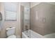 Contemporary bathroom showcasing a tiled shower with glass door and neutral color palette at 4670 Antrim Dr, Sarasota, FL 34240
