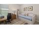 Cozy bedroom featuring a daybed, desk, and neutral décor at 4670 Antrim Dr, Sarasota, FL 34240