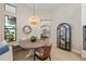 Charming dining area featuring a round table, stylish light fixture, and view of the living room at 4670 Antrim Dr, Sarasota, FL 34240