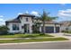 Beautiful single-story home featuring a three-car garage, lush landscaping, and a neutral color palette at 4670 Antrim Dr, Sarasota, FL 34240