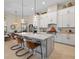 Gourmet kitchen with stainless steel appliances, a large island, and stylish pendant lighting at 4670 Antrim Dr, Sarasota, FL 34240