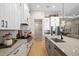 A chef's kitchen featuring quartz countertops, stainless steel appliances, and ample cabinet space at 4670 Antrim Dr, Sarasota, FL 34240