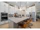 Well-appointed kitchen featuring a large island with seating, and modern cabinetry at 4670 Antrim Dr, Sarasota, FL 34240