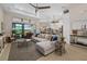 Bright living room featuring an open floor plan, modern furnishings, and access to the lanai at 4670 Antrim Dr, Sarasota, FL 34240