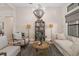 Cozy living room featuring a decorative chandelier, stylish seating, and a neutral color scheme at 4670 Antrim Dr, Sarasota, FL 34240