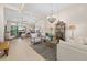 Bright and open living room with contemporary furnishings and seamless access to outdoor patio at 4670 Antrim Dr, Sarasota, FL 34240