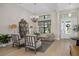 Elegant living room with large windows, contemporary furnishings, and stylish decor at 4670 Antrim Dr, Sarasota, FL 34240