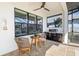 Covered outdoor kitchen equipped with a grill and prep area, complemented by a dining set at 4670 Antrim Dr, Sarasota, FL 34240