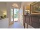 Bright foyer featuring tile floors and an open front door to lush greenery at 4726 Dundee Dr, Bradenton, FL 34210