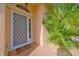 Close-up of the front door with a decorative screen and welcoming mat at 4726 Dundee Dr, Bradenton, FL 34210