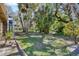 Expansive backyard featuring mature trees and landscaping, perfect for outdoor relaxation at 5060 Village Gardens Dr # 134, Sarasota, FL 34234