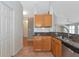 View of kitchen area with stainless steel appliances, granite counters and light wood cabinets at 5127 54Th W St, Bradenton, FL 34210