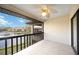 The balcony showcases serene pond views, a ceiling fan, and seamless indoor-outdoor living at 5187 Lake Village Dr # 4, Sarasota, FL 34235