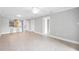 Spacious living area featuring tile floors and an open layout with kitchen and hallway access at 5187 Lake Village Dr # 4, Sarasota, FL 34235