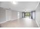 Bright living room with sliding glass doors to a balcony and neutral tile flooring at 5187 Lake Village Dr # 4, Sarasota, FL 34235