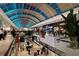 Spacious mall interior with natural light, featuring a variety of retail stores and restaurants at 5187 Lake Village Dr # 4, Sarasota, FL 34235