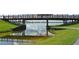 Scenic view of Nathan Benderson Park featuring a wooden walking bridge and the tranquil lake at 5187 Lake Village Dr # 4, Sarasota, FL 34235