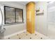 Pantry area featuring a large window, a tall cabinet for storage, and open shelving at 5187 Lake Village Dr # 4, Sarasota, FL 34235
