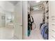 Bright walk-in closet with built-in shelving, hanging rods, and storage for organized convenience at 5238 Title Row Dr, Bradenton, FL 34210