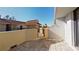 Tiled outdoor patio with partial walls provides a great entertaining space at 5611 Gulf Of Mexico Dr # 5, Longboat Key, FL 34228