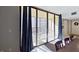 View from dining area to balcony with seating, offering bright outdoor space at 5611 Gulf Of Mexico Dr # 5, Longboat Key, FL 34228