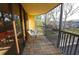 Cozy screened balcony with comfortable seating and a view of lush landscaping at 5611 Gulf Of Mexico Dr # 5, Longboat Key, FL 34228