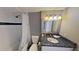 Bathroom featuring tiled shower, granite countertop vanity, and a decorative mirror at 5611 Gulf Of Mexico Dr # 5, Longboat Key, FL 34228