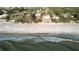 Stunning beachfront homes line the coast, offering direct access to the pristine sandy beach and sparkling ocean views at 5611 Gulf Of Mexico Dr # 5, Longboat Key, FL 34228