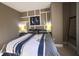 Comfortable bedroom with a king bed, decorative wall art and bedside lamps on the nightstands at 5611 Gulf Of Mexico Dr # 5, Longboat Key, FL 34228