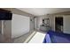 Bedroom featuring tile floors, closet space, and a stylish dresser with mirror at 5611 Gulf Of Mexico Dr # 5, Longboat Key, FL 34228