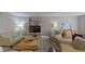 Comfortable living room featuring a large sofa, armchair, and nautical decor at 5611 Gulf Of Mexico Dr # 5, Longboat Key, FL 34228