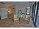 Comfortable lobby area with stylish seating, décor, and view of exterior landscape at 5611 Gulf Of Mexico Dr # 5, Longboat Key, FL 34228