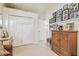 Bedroom featuring hard wood armoire and collection of framed Gathering photos at 6512 Tailfeather Way, Bradenton, FL 34203