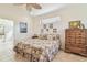 Lovely bedroom with quilt, high ceilings and view of the en suite bathroom at 6512 Tailfeather Way, Bradenton, FL 34203