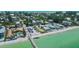 An aerial view shows this property near the beach, with easy access to the pier at 870 N Shore Dr, Anna Maria, FL 34216