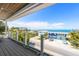 Spacious balcony with seating, ocean views, and surrounding neighborhood at 870 N Shore Dr, Anna Maria, FL 34216
