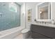 Beautiful bathroom with modern fixtures, a bathtub with shower, and coastal-inspired decor at 870 N Shore Dr, Anna Maria, FL 34216