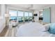 Inviting bedroom boasting ocean views, deck access, and stylish furnishings at 870 N Shore Dr, Anna Maria, FL 34216