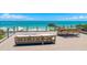 Expansive deck with outdoor seating, dining area, and panoramic ocean views at 870 N Shore Dr, Anna Maria, FL 34216