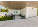 Charming driveway with pavers, rocks, and well maintained yard at 870 N Shore Dr, Anna Maria, FL 34216