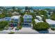 A modern three-story home offers stylish exterior design and a relaxed beach lifestyle at 870 N Shore Dr, Anna Maria, FL 34216