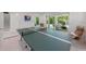 Game room featuring a ping pong table and access to the pool at 870 N Shore Dr, Anna Maria, FL 34216